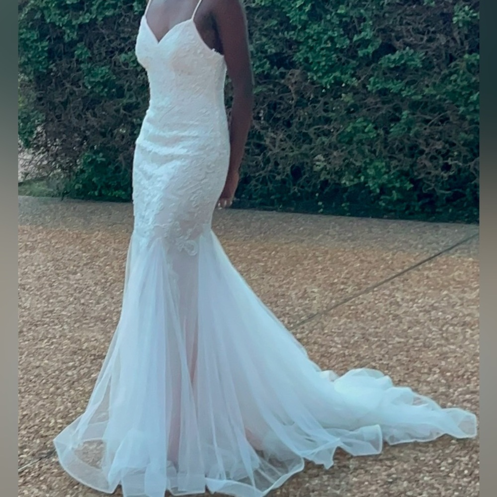 blush pink and white embellished dress with long tulle train
